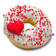 Load image into Gallery viewer, PAWFECT DOGGY DONUTS with white icing, red and silver sprinkles, and a heart-shaped decoration.