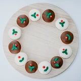 Load image into Gallery viewer, DOGGY CHRISTMAS PUDDING - Pack of 2 displayed in a festive circular arrangement on a wooden platter.