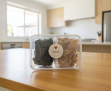 Load image into Gallery viewer, VARIETY PACK - DEHYDRATED DOG TREATS in a clear container showing diverse flavors for pet enjoyment.