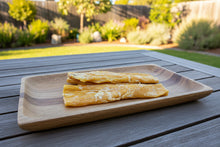 Load image into Gallery viewer, 3 pieces of 30cm dried beef tendon on a tray in an Australian back yard