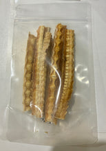 Load image into Gallery viewer, Five pieces of dried shark cartilage product in a clear plastic bag on a white background