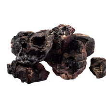 Load image into Gallery viewer, A pile of dried goat heart slices on a solid white background.