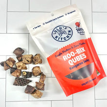 Load image into Gallery viewer, ROO BIX QUBES - Kangaroo Jerky in a 100g bag with treats scattered around, 100% Australian made.