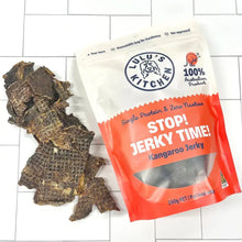 Load image into Gallery viewer, STOP! JERKY TIME! - Kangaroo jerky pieces next to the packaging, showcasing the lean treat for pets.
