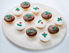 DOGGY CHRISTMAS PUDDING - Pack of 2 festive dog treats on a wooden platter.