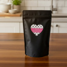 Load image into Gallery viewer, Black snack bag with a heart-shaped label on a white background
