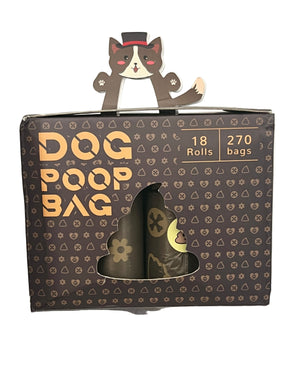 Dog poop bag packaging with a cartoon dog on top, displayed on a clear surface.