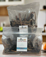 Load image into Gallery viewer, Two packages of Aussie Roo Tendons with visible branding on a kitchen counter.
