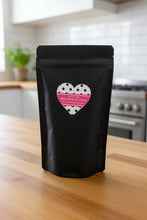Load image into Gallery viewer, Black snack bag with a heart-shaped label on a white background
